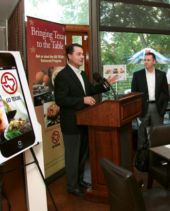 Texas Agriculture Commissioner Todd Staples, at podium, promotes eating locally during the statewide GO TEXAS Restaurant Round-up
